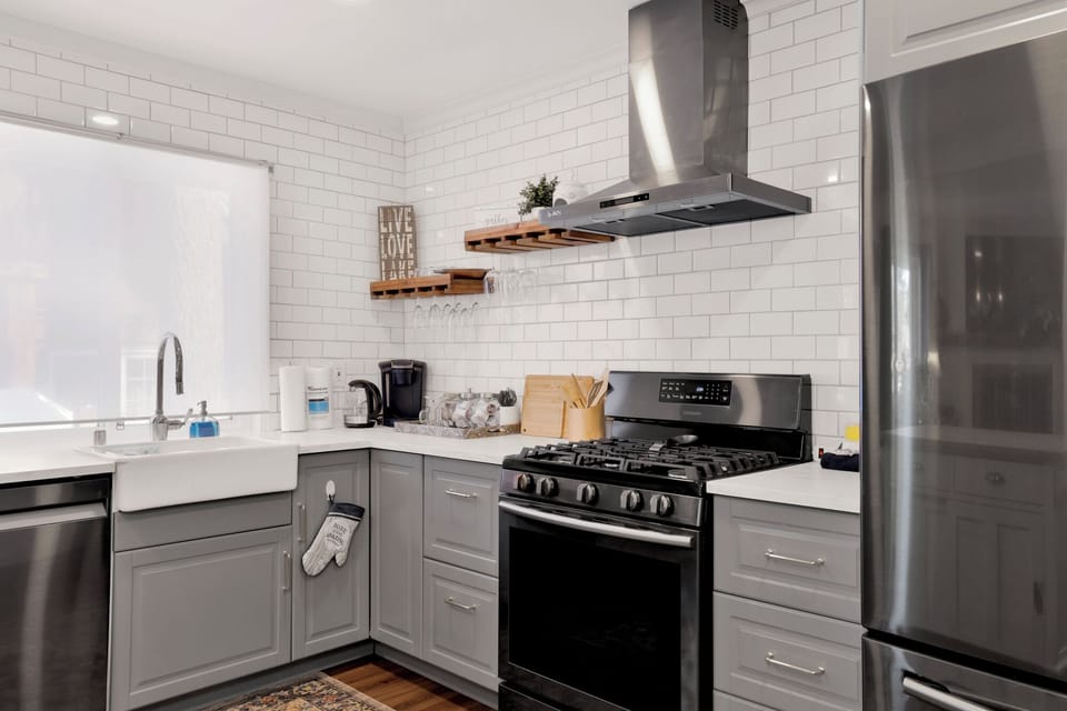 Cook like a pro in this large gourmet kitchen featuring a stunning granite island, bar seating, and stainless appliances. Plenty of space for the whole group to prep meals together.
