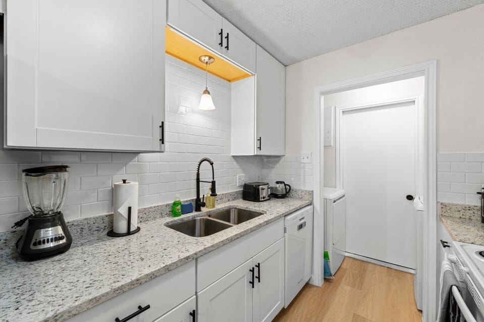 A bright, refreshed kitchen where you can prep snacks and drinks before settling in to watch the next match.