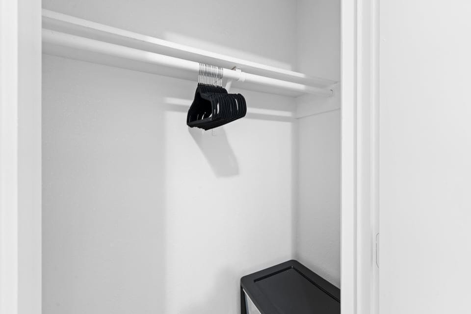 Extra closet space with hangers and a storage bin makes it easy to unpack and settle in for your stay.
