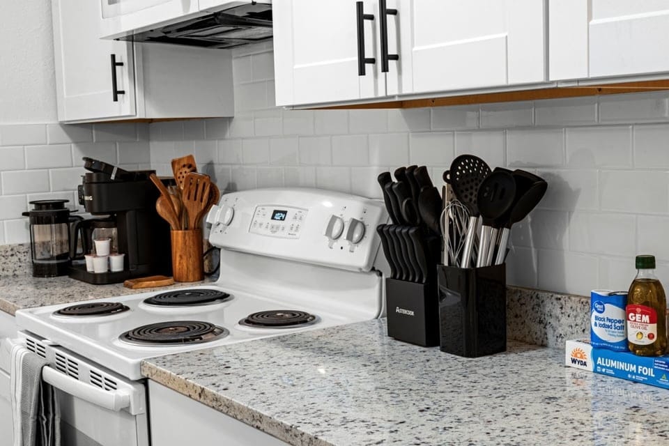 Fully stocked kitchen with cookware, knife set, coffee station, and all the essentials for easy meals during your stay.