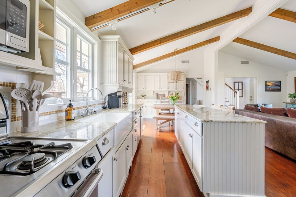 Open concept kitchen, dining, and living room. Also leads to outdoor patio.