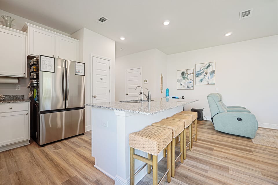 Your modern kitchen island becomes a perfect breakfast bar while you sip coffee and plan your day's adventures.