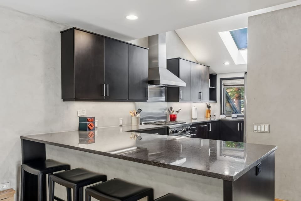 Fully equipped chef’s kitchen with bar seating