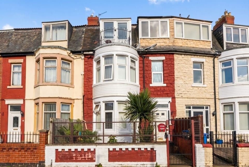 Classic seaside terrace exterior on a bright sunny day.