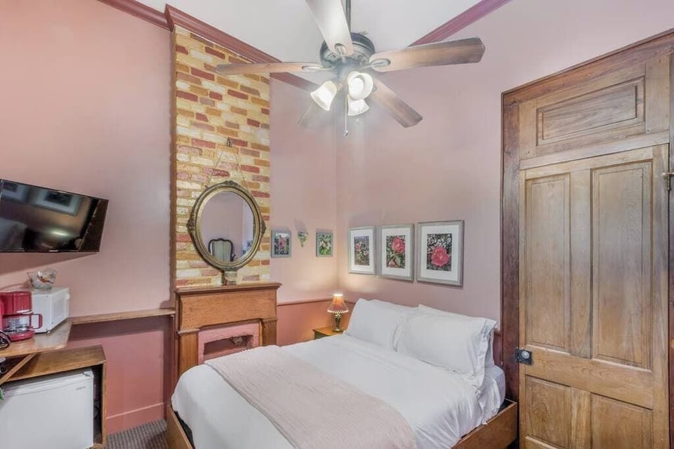Another angle of the bedroom highlighting its character, wood accents, and relaxed feel.
