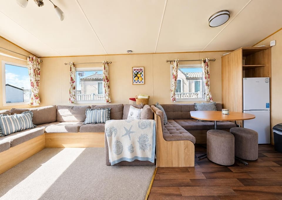 Situated conveniently opposite the kitchen, this dining table is the ideal spot for sharing meals, playing board games, or simply planning your next day's adventure on the Norfolk coast.