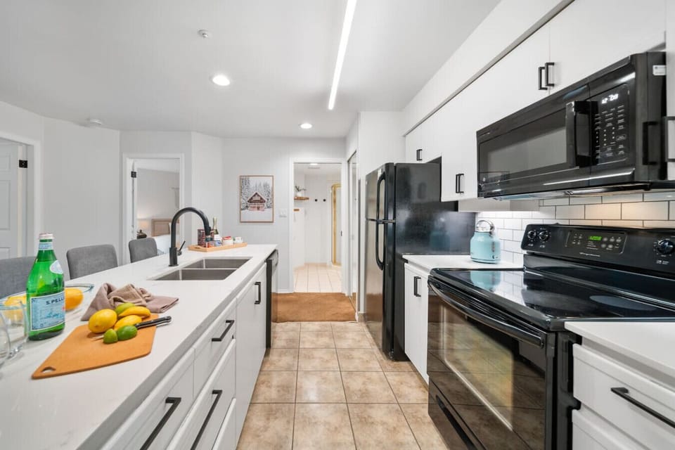 Fully equipped kitchen with quality cookware, utensils, and modern appliances