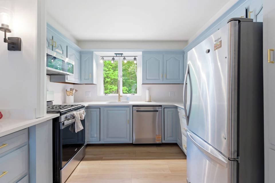 Bright and welcoming full kitchen filled with natural light