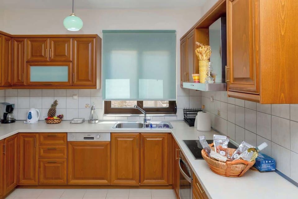 A practical kitchen layout designed for comfort and ease, allowing you to cook while staying connected to the rest of the space.
