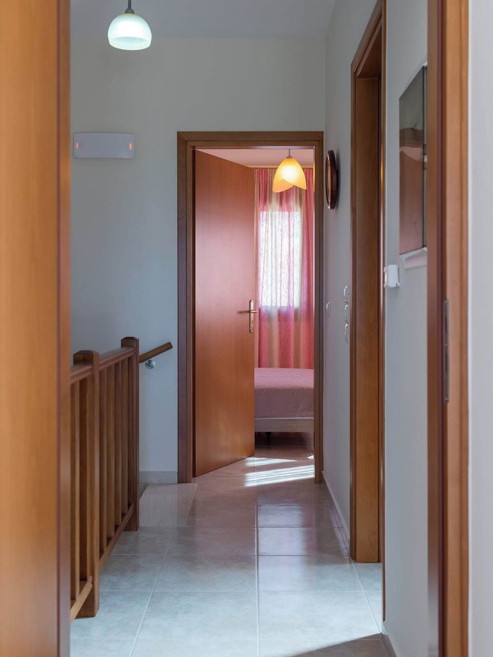 The corridor connects the rooms while maintaining a clear and practical layout throughout the house.