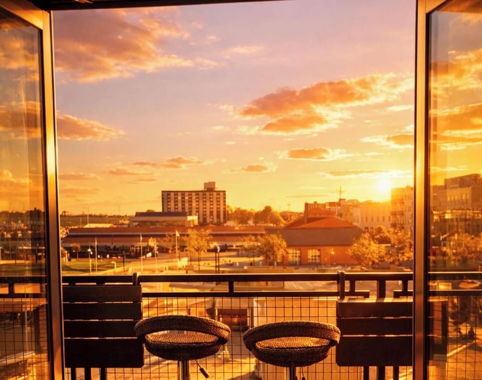 Unwind with breathtaking sunset views over downtown and the waterfront. Floor-to-ceiling glass brings warm evening light straight into your loft retreat.