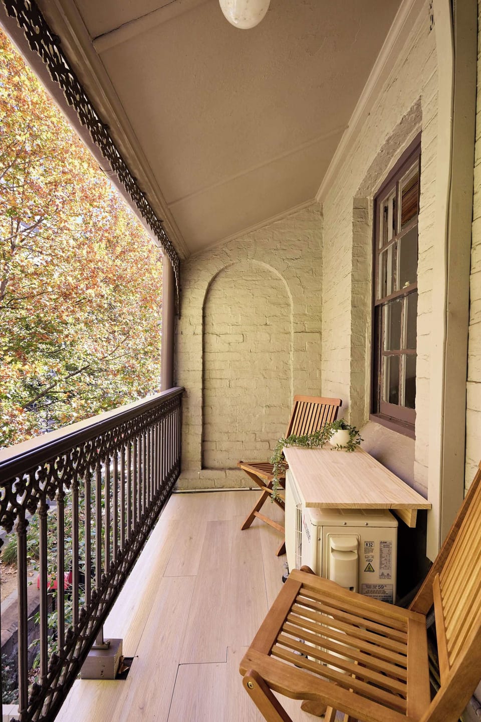This charming private balcony, located in our second bedroom, offers a peaceful outdoor retreat that perfectly preserves the home's historic character.
