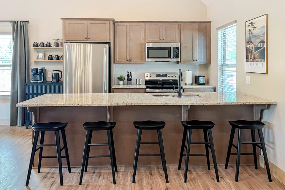 Gather around the island for coffee, conversation, and easy mornings.