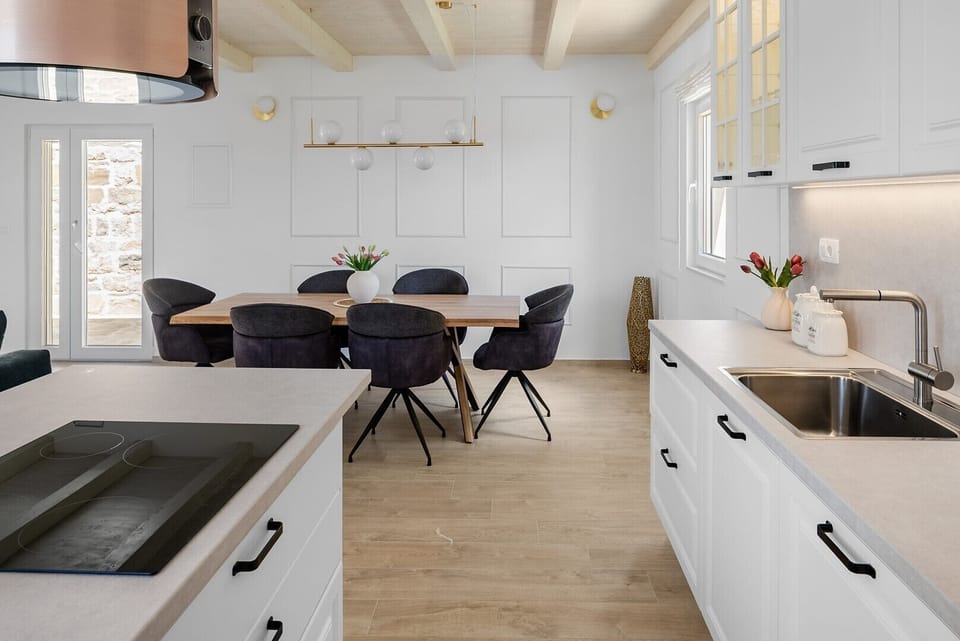 The modern kitchen is fully equipped and features a stylish kitchen island.