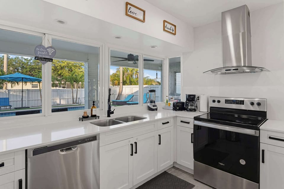 Fully equipped kitchen with premium stainless steel appliances and ample counter space
