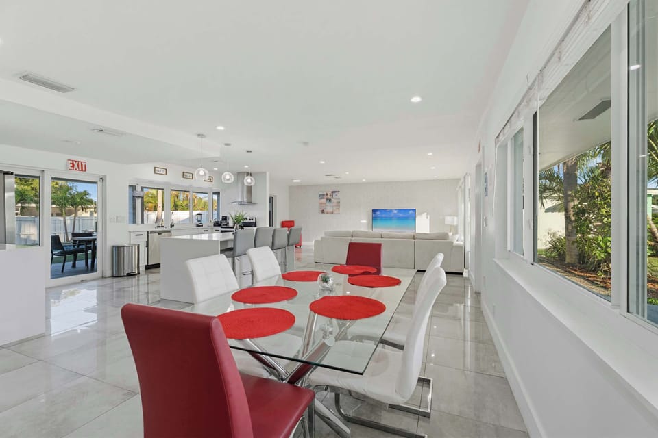 Modern dining area with seating for the whole family, flooded with natural light.