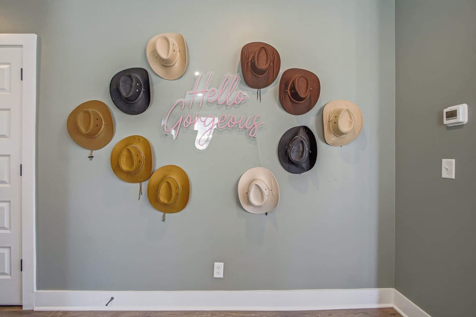 Step into charm with a stylish hat display and a cheerful greeting!