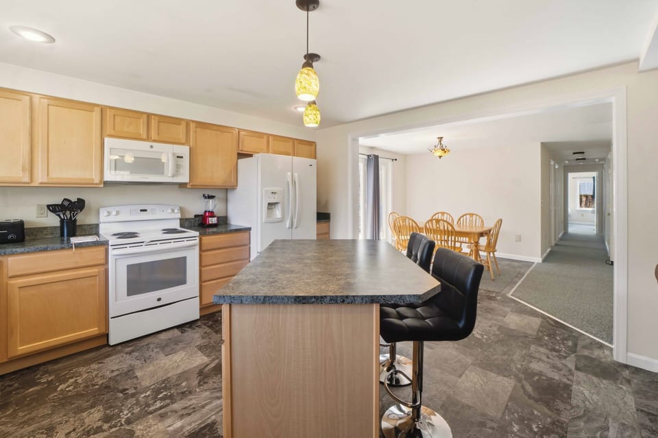 Your spacious kitchen features modern appliances and granite countertops, perfect for preparing meals during your stay.