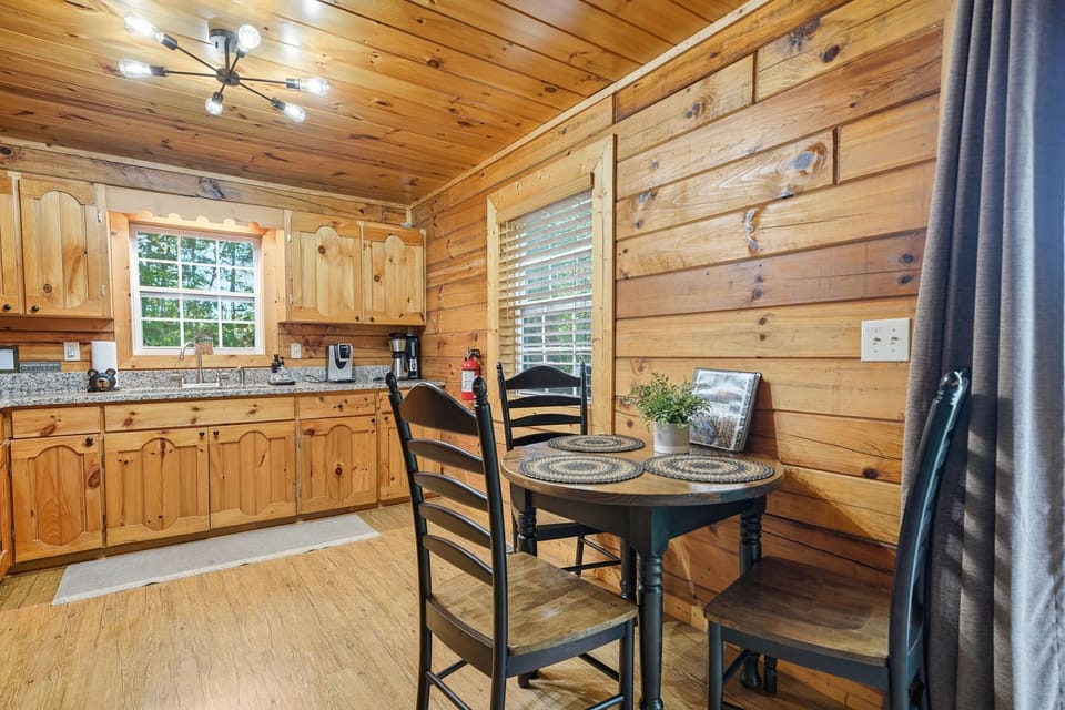 Intimate dining nook perfect for relaxing meals in a cozy cabin setting.