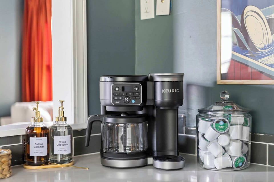 Kitchen counter w/ a coffee maker & small appliances ready for easy morning routines.
