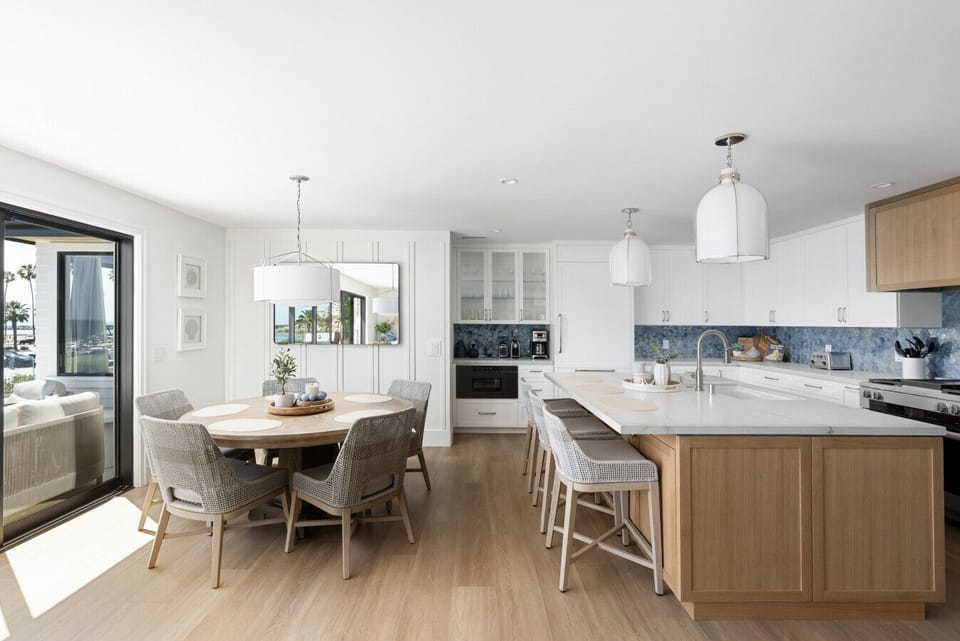 Bright dining area opening into the kitchen, with seating for the whole group.