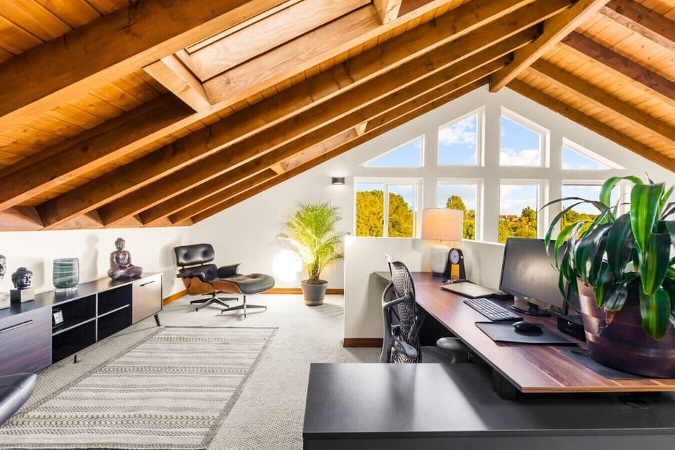 A second office or creative studio space with French doors, natural light, and an artistic, inspired feel — perfect for remote workers or creatives.