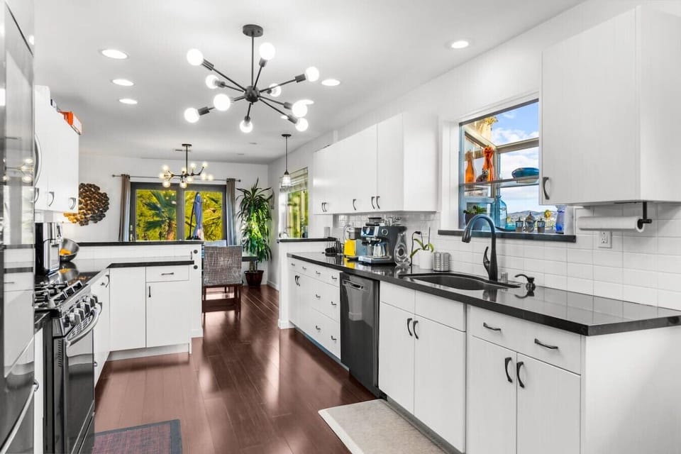 High-end appliances and a smart layout make this kitchen genuinely functional for groups — whether you`re cooking a quick breakfast or a full dinner.