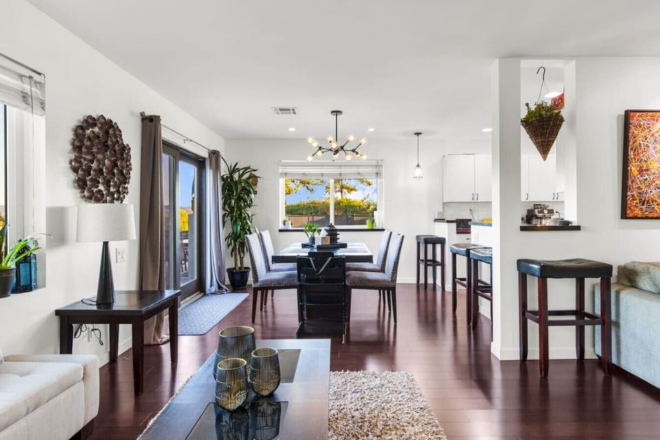 Seat the whole group at the dining table with backyard views and natural light streaming in — a layout that makes shared meals feel easy and enjoyable.