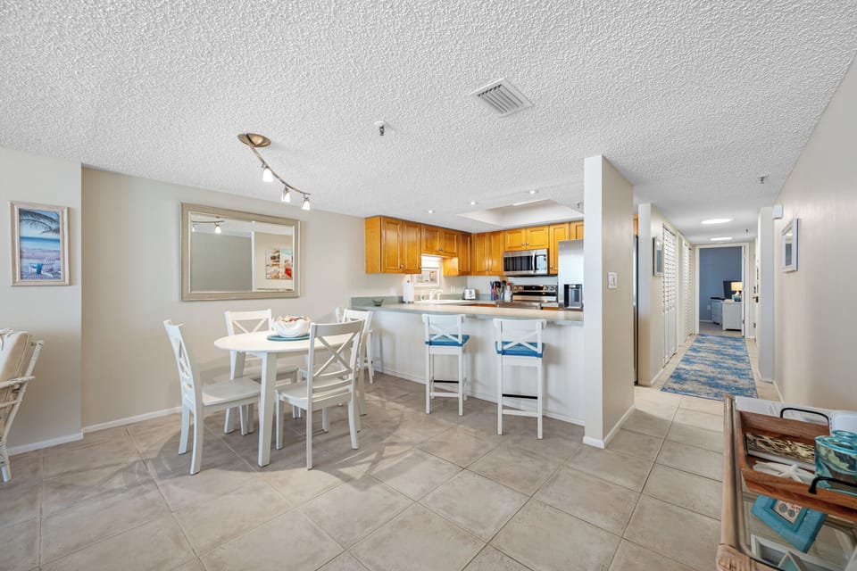 #103 Dining Table for four and 3 bar stools at the breakfast bar.