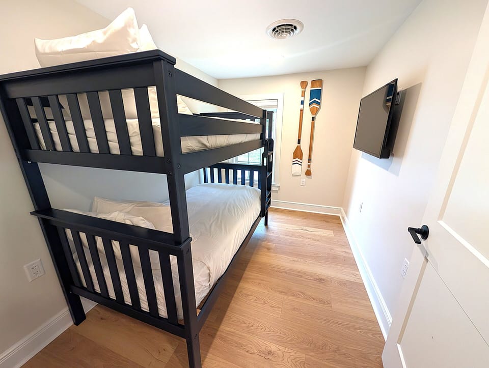 Cozy bunk room with TV