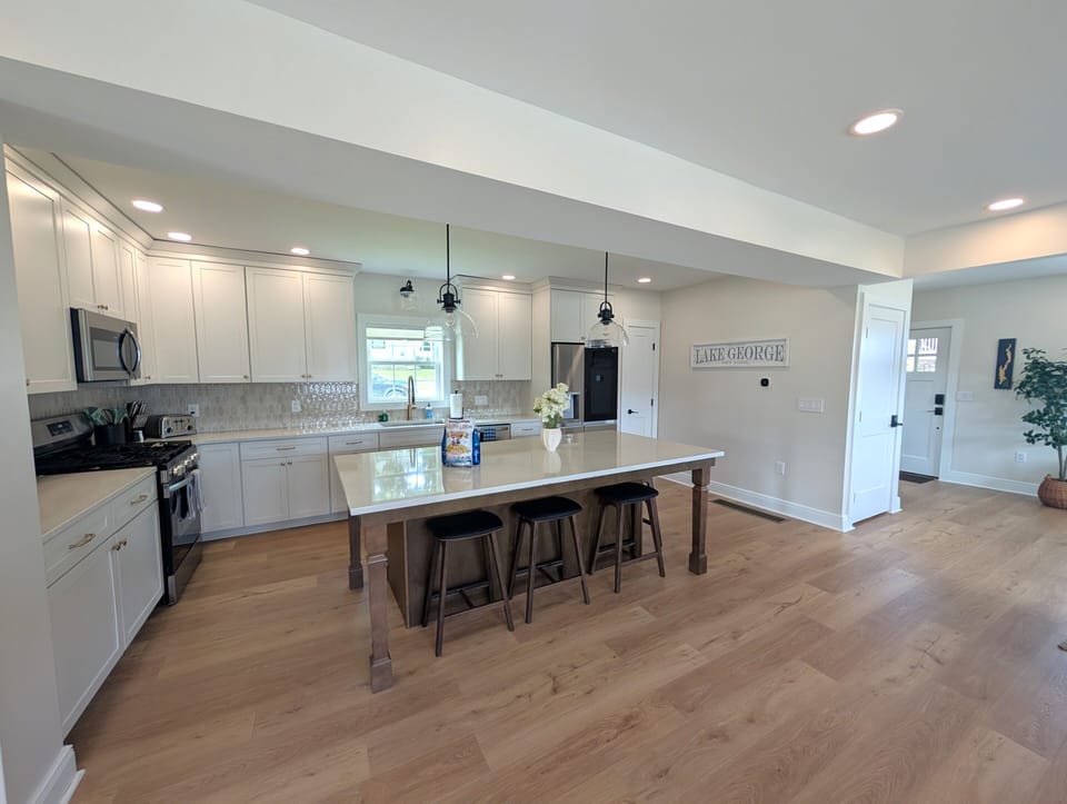 Spacious gourmet kitchen with large island seating and open layout