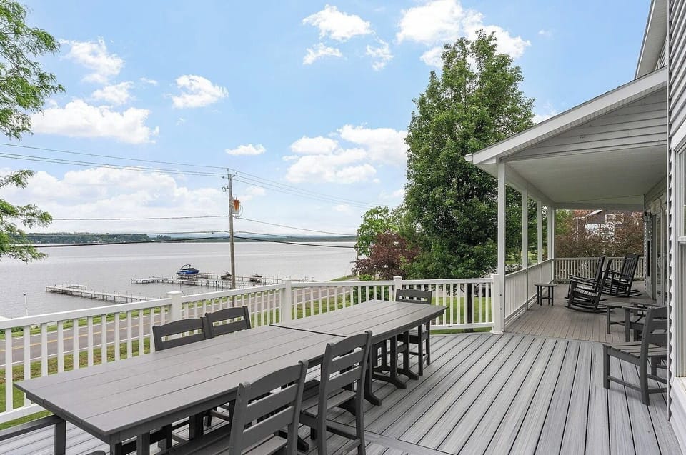 Enjoy lakeside dining on the spacious firs-floor deck featuring a large double dining table and beautiful Saratoga Lake views.