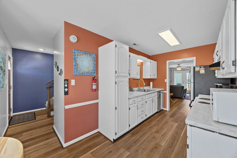 Fully equipped galley-style kitchen stocked with cookware, coffee essentials, and everything needed to prepare meals during your stay.