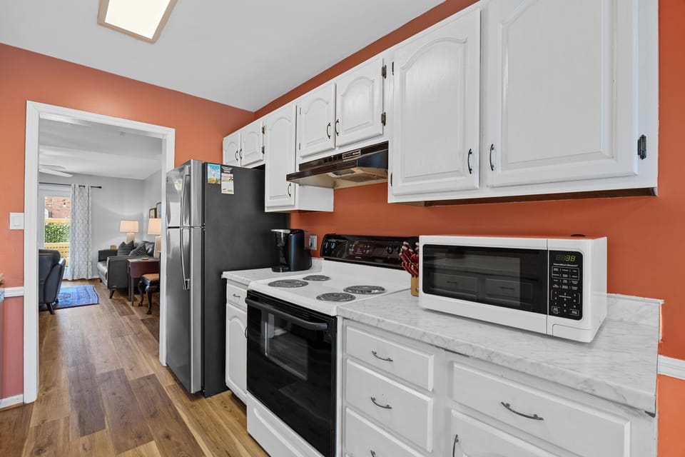 Fully equipped galley-style kitchen stocked with cookware, coffee essentials, and everything needed to prepare meals during your stay.