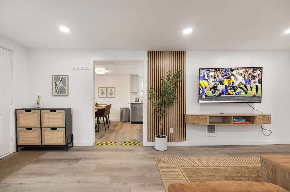 Seamless flow between living room and dining/kitchen area.