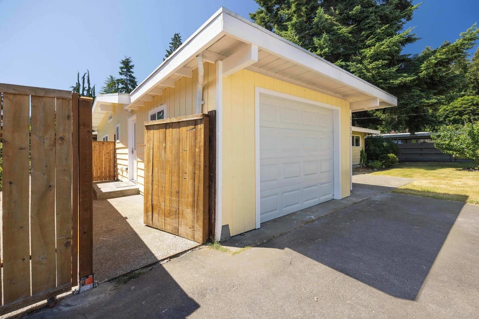 Private side entrance and garage access offering easy arrival and added privacy.