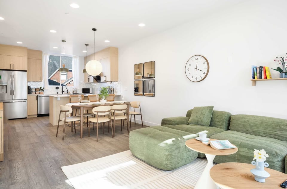 Bright open floor plan connecting kitchen, dining, and living in effortless harmony.