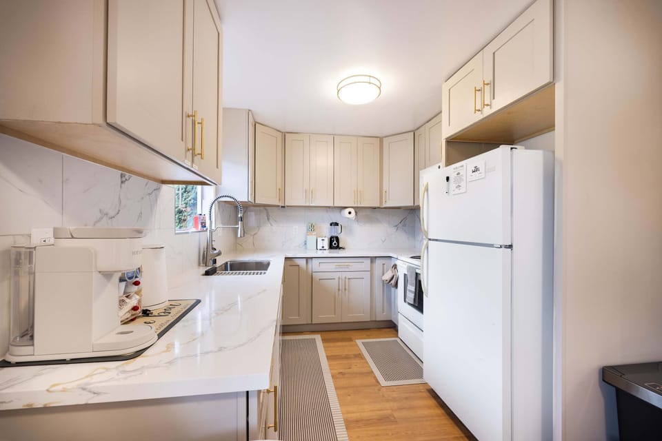 Clean, modern kitchen with plenty of cabinet space and everything you need to cook at home.