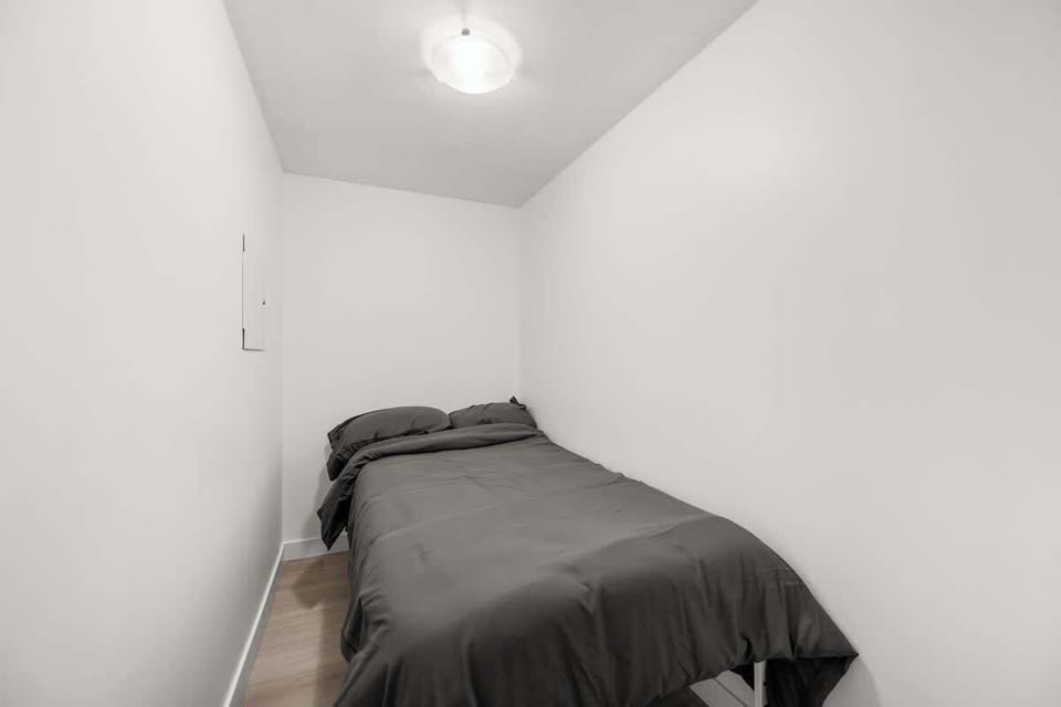 Private den with a comfortable double size bed, perfect as an extra sleeping area. This space is not a bedroom but a den, thoughtfully set up to accommodate additional guests.