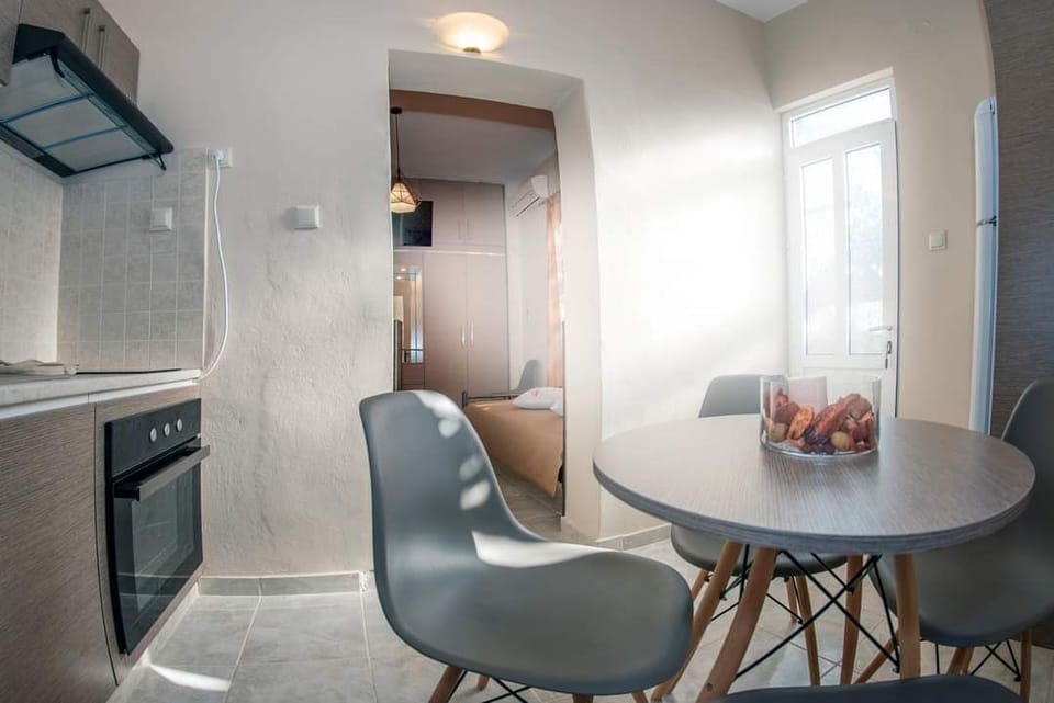 The kitchen layout combines modern appliances with a practical dining space designed for easy everyday use during longer stays.