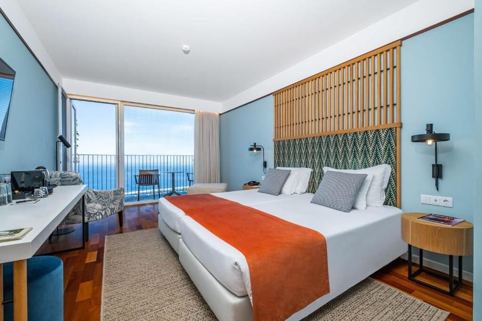 Wake up to ocean horizons from your serene, modern bedroom.