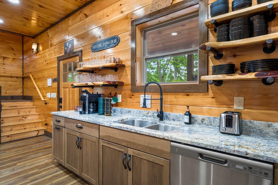 Spacious kitchen with plenty of counter space, cookware, and modern appliances for family gatherings.