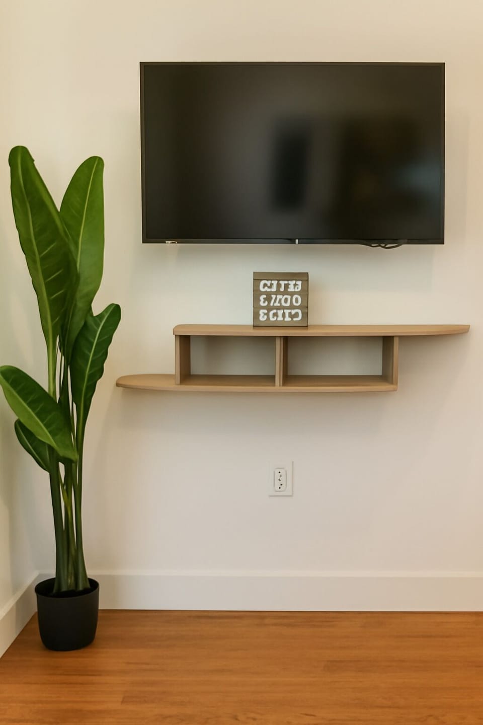 Spacious living room with a smart TV and modern decor.