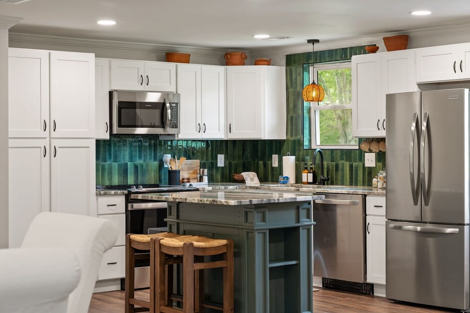 Our kitchen; fully stocked with cookware, dishes, appliances, and more. Everything you need to host.
