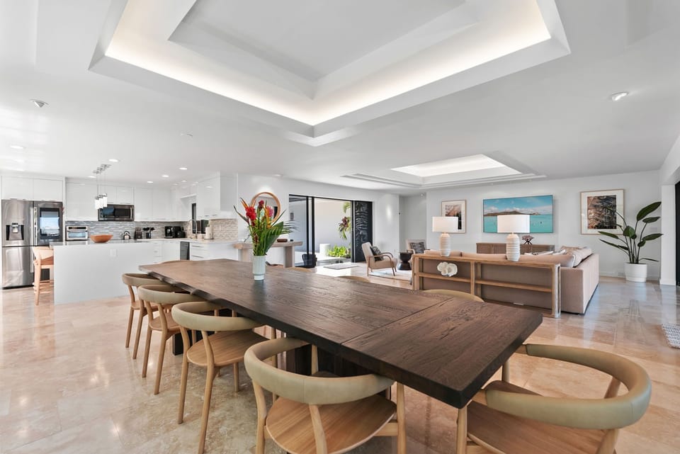 Open-concept layout connecting kitchen, dining, and living in one fluid space.