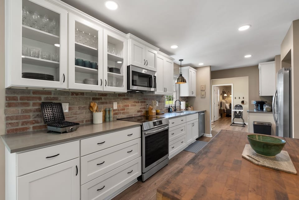 Our kitchen is spacious and well stocked. It is perfect for cooking!