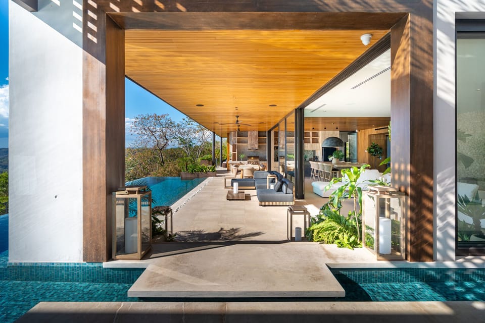 Open-air luxury living and infinity pool design at Villa Kuji Biri in Santa Teresa, Costa Rica.