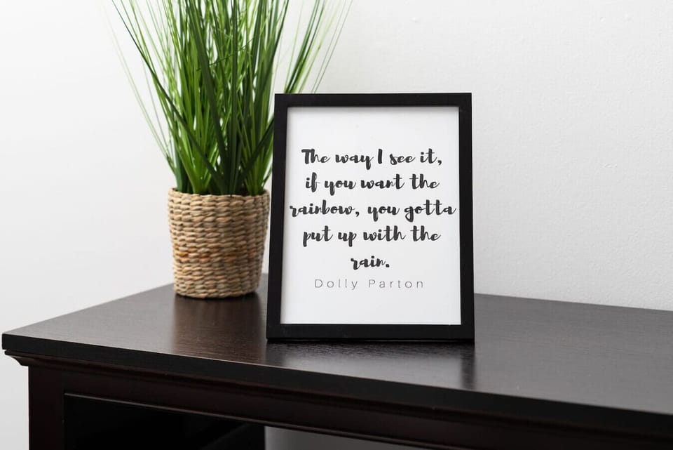 Charming decor detail with greenery and playful wall art.