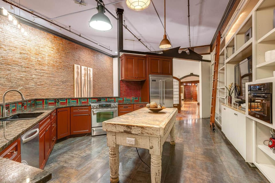 Gourmet kitchen with sleek finishes and views.