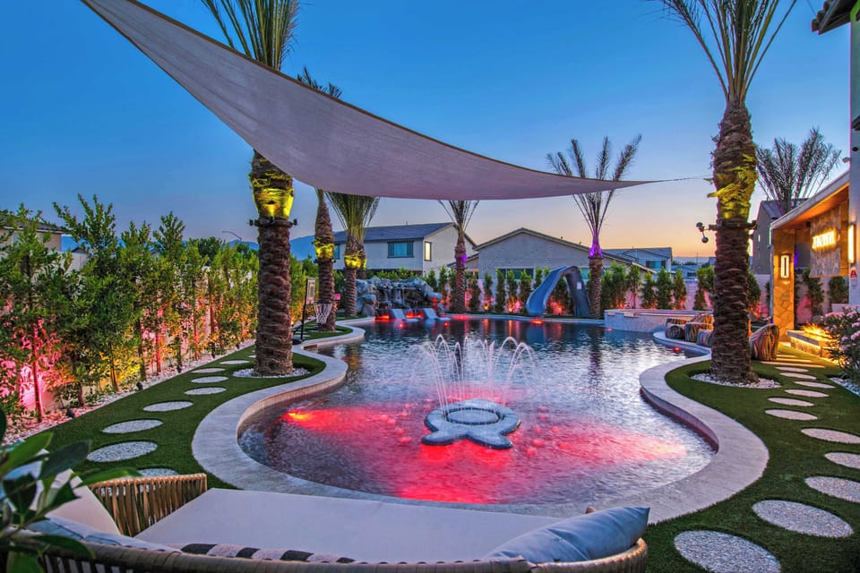 As the sun sets, the backyard transforms with glowing LED pool lights and illuminated fountains. Relax under the stars or enjoy an unforgettable evening swim in your private resort-style oasis.